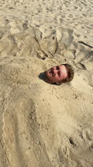 Sand burial antics on a Rimini beach afternoon