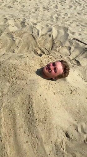 Sand burial antics on a Rimini beach afternoon