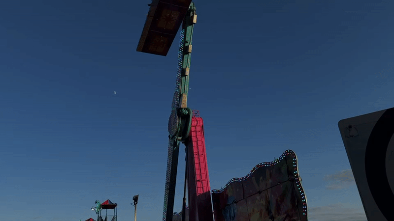 Summer carnival night in Gatineau, rides spinning at dusk