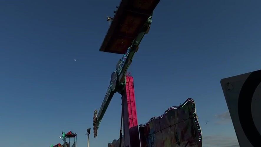 Summer carnival night in Gatineau, rides spinning at dusk