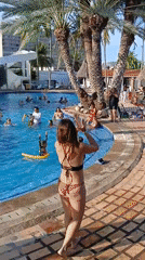 Resort pool party with live entertainment captured in Porlamar