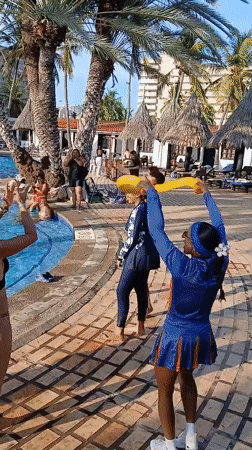 Resort pool party with live entertainment captured in Porlamar