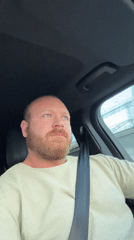 Driver sings along to music in car in Chaikovsky
