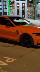 Orange BMW spotted parked on Nesebar street during evening