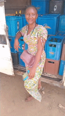 Woman at beer delivery truck, seed pods examined in Jos
