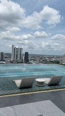 Morning routine across a Phnom Penh high-rise: pool, gym, city views