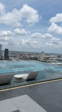 Morning routine across a Phnom Penh high-rise: pool, gym, city views