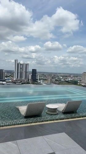 Morning routine across a Phnom Penh high-rise: pool, gym, city views