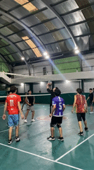 Evening volleyball game observed in Wilde, Argentina gymnasium