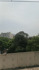 Morning cityscape view captured from elevated transport in Dhaka