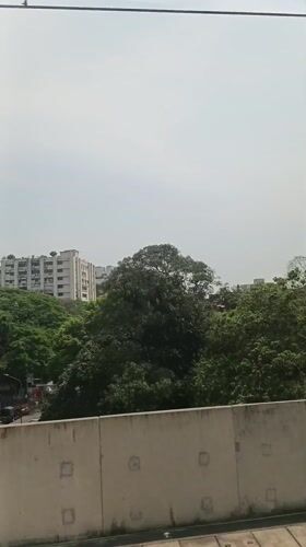 Morning cityscape view captured from elevated transport in Dhaka