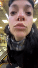 Woman observed on transit escalator in Buenos Aires