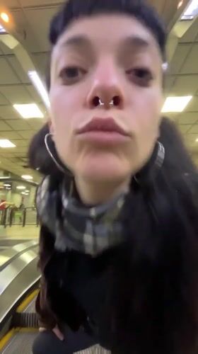 Woman observed on transit escalator in Buenos Aires