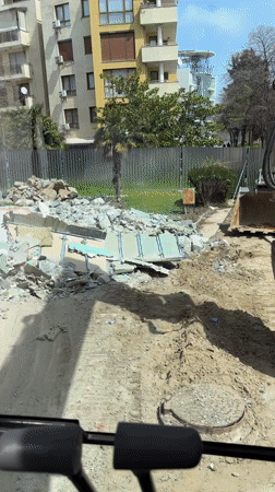 Construction vehicle operates at demolition site in Nesebar
