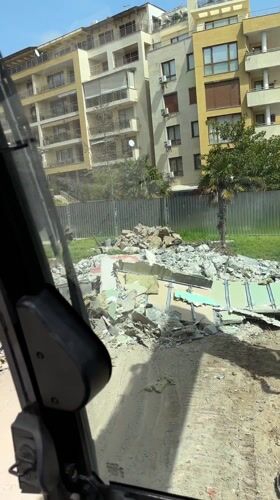 Construction vehicle operates at demolition site in Nesebar