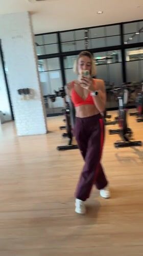 Woman records gym mirror selfies in Rawai, Thailand