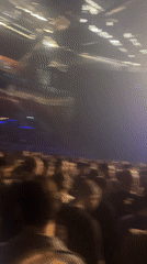 Concert draws large crowd with blue stage lighting