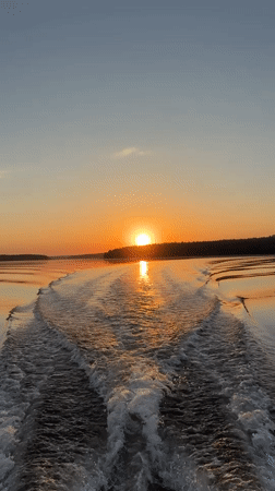 Sunset observed from boat on water near Votkinsk, Russia