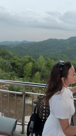 Pool day in Yiwu, kids and adults, hills in the background