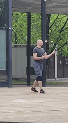 Morning street performance and dog training observed in Moscow park
