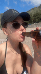 Woman films beach selfie videos at Montenegro's Kamenovo bay