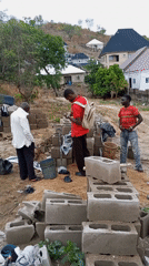 Construction crew works with cinder blocks in Lokoja, Nigeria