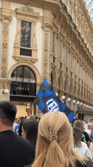 Typical Sunday crowds gather at Milan's Duomo and luxury shopping arcade