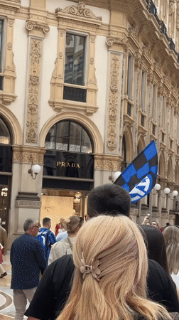 Typical Sunday crowds gather at Milan's Duomo and luxury shopping arcade
