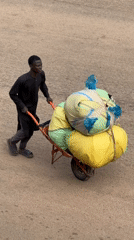 Morning street life and commerce in Bukuru, Nigeria