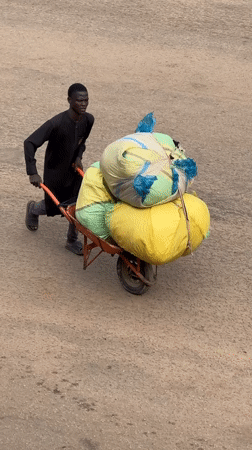 Morning street life and commerce in Bukuru, Nigeria