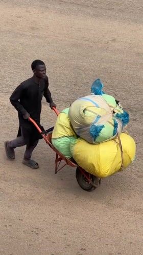 Morning street life and commerce in Bukuru, Nigeria