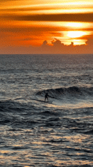 Morning beach activity and entertainment in North Kuta
