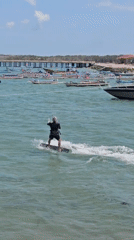 Kitesurfers out at Sanur Beach on a sunny Bali morning