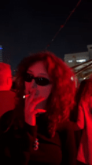 Outdoor DJ Party with Red Lighting Draws Crowds in Haifa