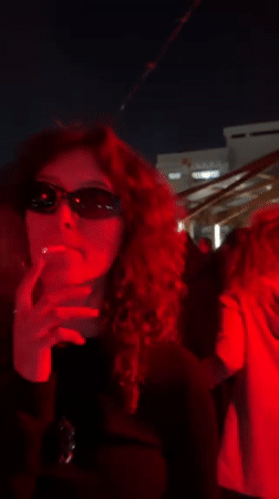 Outdoor DJ Party with Red Lighting Draws Crowds in Haifa