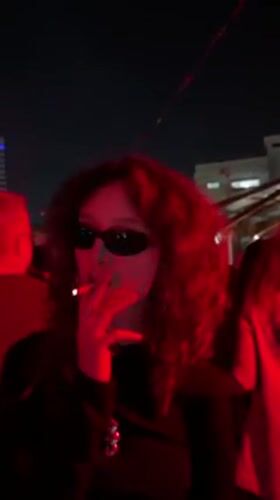 Outdoor DJ Party with Red Lighting Draws Crowds in Haifa