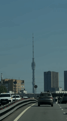 Morning traffic flows past Ostankino Tower in Moscow