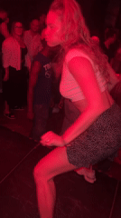 Dancing under red lights at a Warsaw nightlife spot