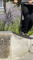 Scooter tricks and neighborhood scenes at a Maurepas skate park