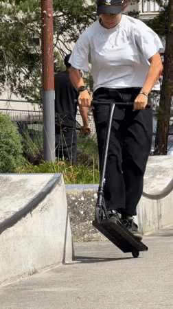 Scooter tricks and neighborhood scenes at a Maurepas skate park