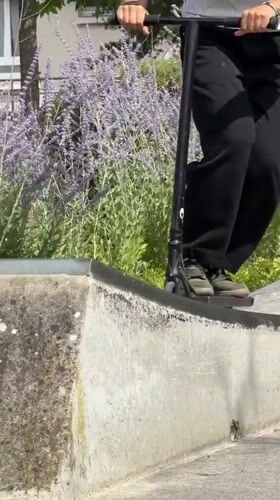 Scooter tricks and neighborhood scenes at a Maurepas skate park