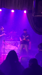 Live band set under colored lights in Buenos Aires