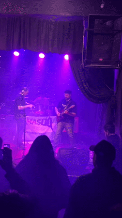 Live band set under colored lights in Buenos Aires