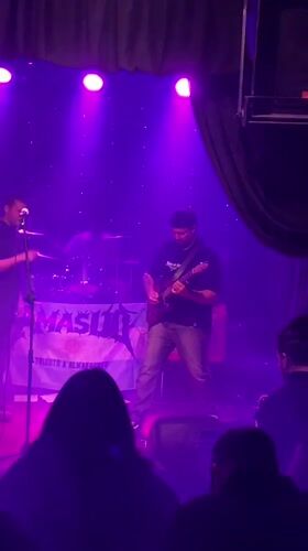 Live band set under colored lights in Buenos Aires