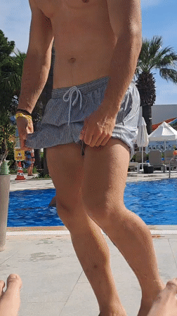 Tourist relaxes poolside at Kuşadası resort on sunny afternoon