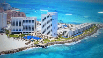 Morning aerial tourism footage captures resorts, pyramids, paragliding activities