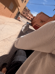 Motorcyclist documents afternoon ride through Ouaouizert's colorful streets