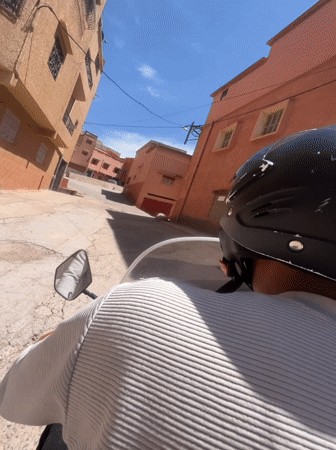 Motorcyclist documents afternoon ride through Ouaouizert's colorful streets