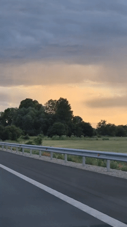 Evening highway drive through rural Bulgaria at sunset