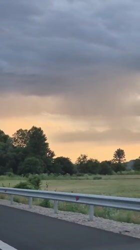 Evening highway drive through rural Bulgaria at sunset